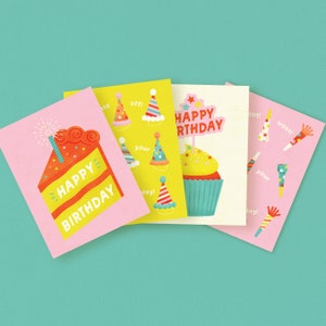 May include: Four pink and yellow birthday cards with different designs. One card features a slice of cake with the text "Happy Birthday". Another card has a cupcake with the text "Happy Birthday". The other two cards have party hats and the text "Woot!" and "day!"