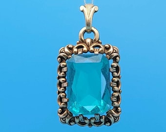 Art Nouveau antique double pendant gold plated light blue cut stone aquamarine colored