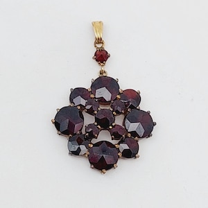 Antique Biedermeier pendant tombac with garnet stones