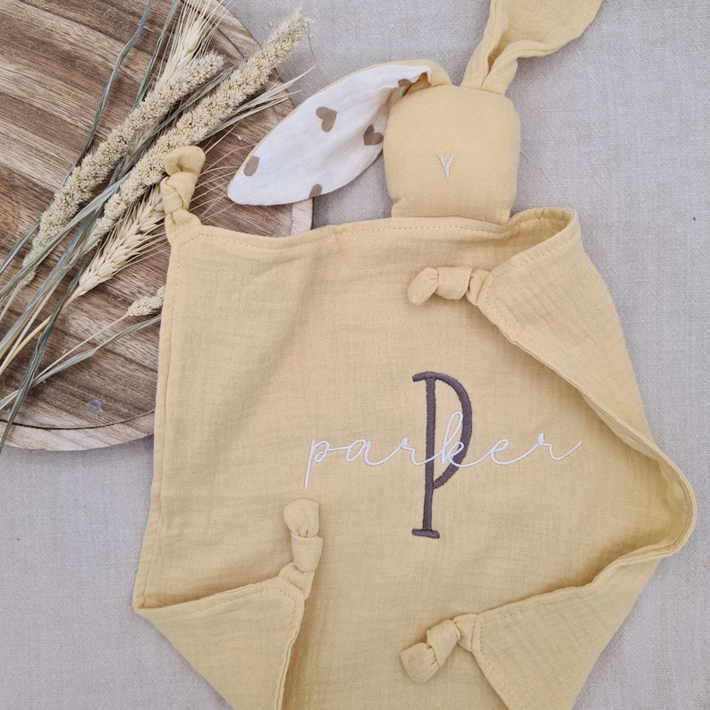 yellow muslin bunny with cute hearts ear pattern and chocolate brown embroidered baby name initial and white baby name