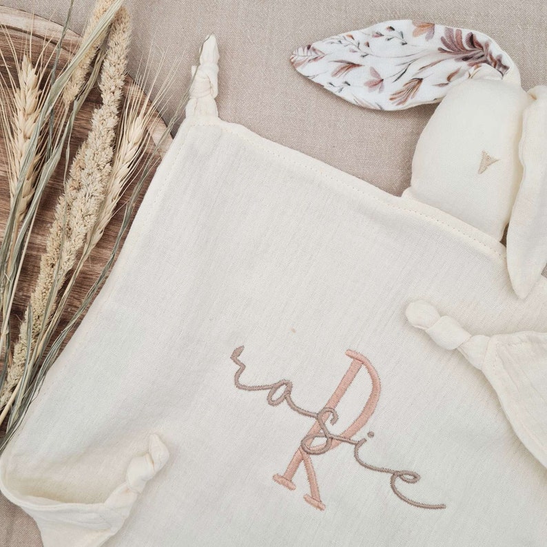 Ivory bunny with floral pattern ears and pastel colour embroidered baby name