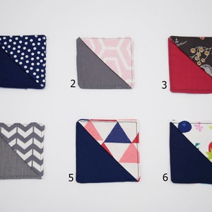 May include: Six fabric squares with different patterns. Each square is divided diagonally with a contrasting color. The patterns include polka dots, geometric shapes, chevron, and floral designs. The colors include navy blue, gray, pink, red, and brown.