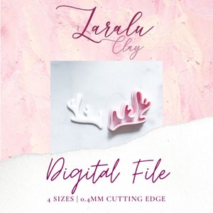 May include: Two white plastic reindeer antler cookie cutters, one with a pink outline. The cutters are on a white surface with the text "Digital File" and "4 SIZES | 0.4MM CUTTING EDGE" below.