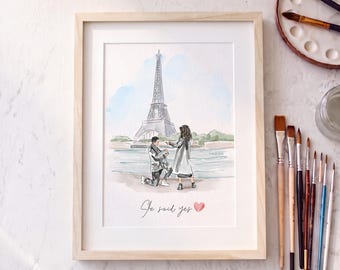 May include: A framed watercolor print featuring a proposal scene in front of the Eiffel Tower in Paris. The illustration depicts a person kneeling before another, with the handwritten text "She said yes" and a small pink heart below.
