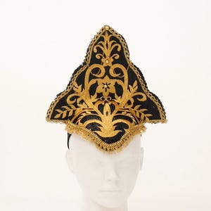 Black and gold triangular shape headwear