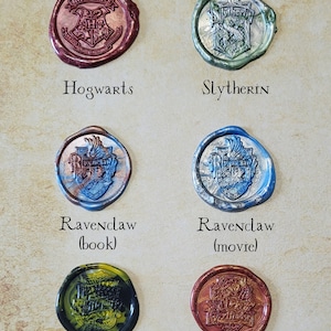 May include: Wax seals with the Hogwarts house crests: Gryffindor, Hufflepuff, Ravenclaw (book and movie versions), Slytherin, and Hogwarts.