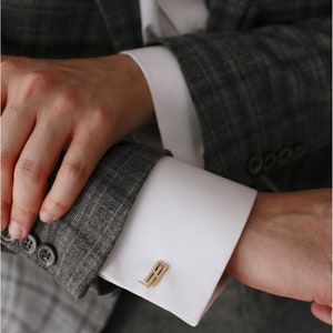 "AJ" cufflink in yellow color