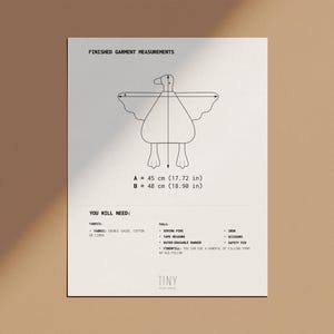 May include: A white paper with a line drawing of a bird-like figure, with measurements of 45 cm (17.72 in) and 48 cm (18.90 in). The text "FINISHED GARMENT MEASUREMENTS" and "YOU WILL NEED" are also present.