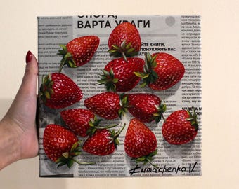 May include: A painting of ripe strawberries arranged on a canvas with a newspaper background. The strawberries are a vibrant red with green stems and leaves. The canvas has text in a foreign language.