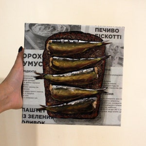 Vintage-Inspired Sprats and Bread Oil Painting: Unique Kitchen Decor with Newspaper Fish Art