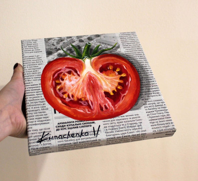 May include: A painting of a red tomato cut in half, with seeds visible, on a newspaper background. The painting is titled "Kumachenko V" and includes the text "Archeologists have unearthed the steps of the Siloam pool, where Jesus healed the blind man."