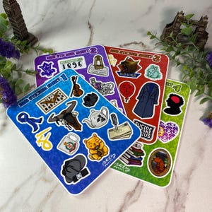 May include: Four sticker sheets with various illustrations. Sheet 1 is blue with a violin, bull skull, and cat. Sheet 2 is purple with a judge's wig and the number 1895. Sheet 3 is red with a wolf and coat. Sheet 4 is green with a dog portrait.