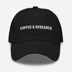 May include: Black baseball cap with white embroidered text that reads "COFFEE & RESEARCH".