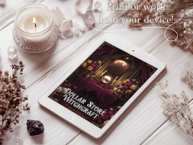 May include: A white tablet displays an image with the text "Dollar Store Witchcraft." The image features a table with candles, flowers, and a mirror. A lit candle in a glass jar and crystals are also visible.