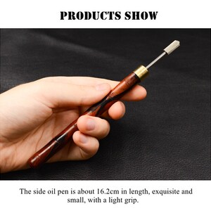 May include: A wooden side oil pen with a brass tip and a striped wood handle. The pen is about 16.2 inches long.