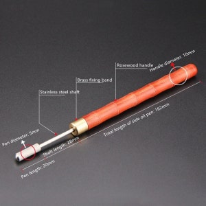 May include: A rosewood handle side oil pen with a brass fixing band and a stainless steel shaft. The pen is 16.2 inches long, with a 10mm handle diameter and a 5mm pen diameter.