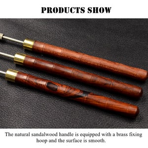 May include: Three wooden handled tools with brass accents. The tools have a natural sandalwood finish and are laid out on a dark brown surface.