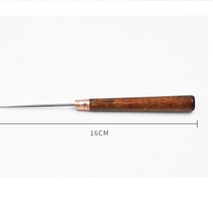 May include: A wooden-handled awl with a metal needle, measuring 16 inches in length. The awl is a tool used for piercing holes in leather or other materials.