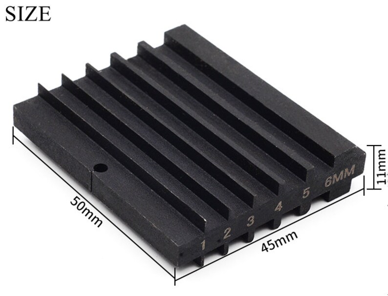 May include: Black metal ring sizing gauge with six numbered slots, measuring 1.11 inches by 1.77 inches by 2 inches.