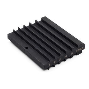 May include: Black metal gauge with six slots numbered 1 to 6 and 6MM. The gauge is used for measuring the diameter of round objects.