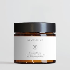 Könnte beinhalten: Ein braunes Glas mit schwarzem Deckel und weißem Etikett. Das Etikett trägt den Text "BRAND NAME", ein Blattdesign und "Product Name". Der Text darunter lautet "pflegen Sie Ihre Haut mit unserer reichhaltigen und feuchtigkeitsspendenden Formel".