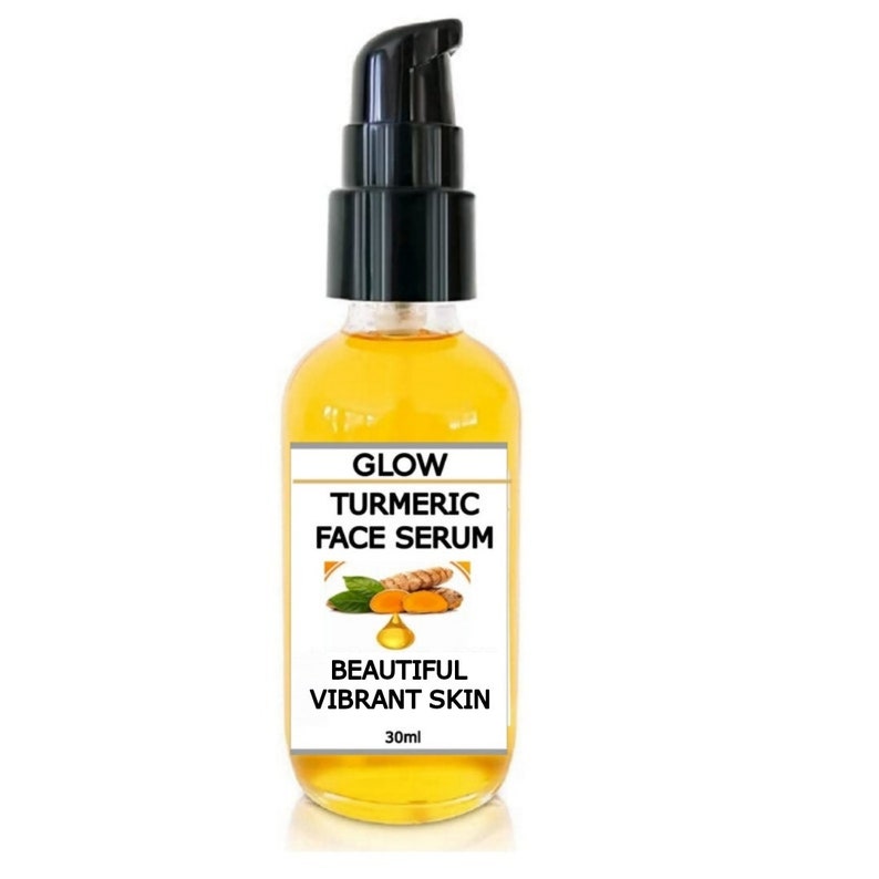 May include: A clear glass bottle with a black pump dispenser filled with a yellow liquid. The label reads "Glow Turmeric Face Serum" and "Beautiful Vibrant Skin" with a small image of turmeric root and leaves. The bottle contains 30 ml of serum.