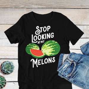 May include: Black t-shirt with white text that reads "Stop Looking At My Melons". The text is surrounded by a watermelon graphic.