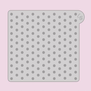 Könnte beinhalten: Eine graue, quadratische Schablone mit abgerundeten Ecken und einem sich wiederholenden Muster aus gleichmäßig verteilten, kleinen grauen Kreisen. Die Schablone hat eine kleine Lasche mit den Initialen "EB" in der oberen rechten Ecke. Der Hintergrund ist hellrosa.