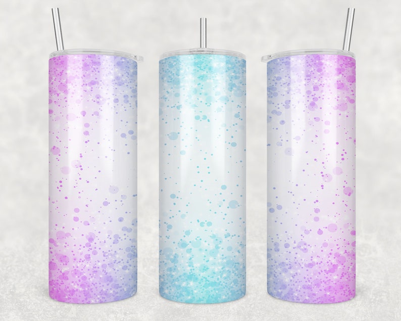 May include: Three stainless steel tumblers with lids and straws. The tumblers have a white background with a gradient of pink, blue, and purple speckles.