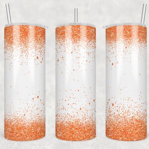 May include: Three stainless steel tumblers with a white background and a gradient of orange glitter at the bottom. The tumblers have clear lids and straws.