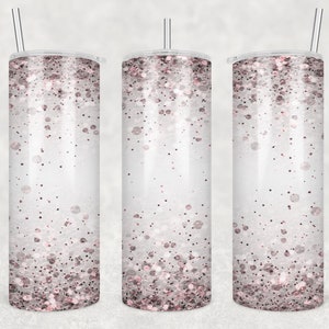 May include: Three stainless steel tumblers with a white background and a pink glitter design. The tumblers have lids and straws.
