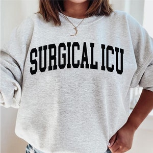 Infermiera chirurgica in terapia intensiva Felpa Girocollo trauma team Infermieri dell&#39;unità di terapia intensiva, T-shirt regalo per laureati in terapia intensiva medica Tee Infermiera in terapia intensiva