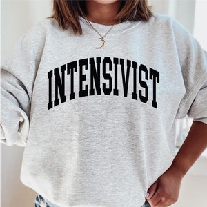 Intensivist Sweatshirt, hoodie, shirt, tank top, gift, educated vaccinated, critical care physician, ICU doctor, graduation