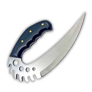 May include: A black handled knife with a curved blade and a serrated edge. The handle has a textured design and gold accents.