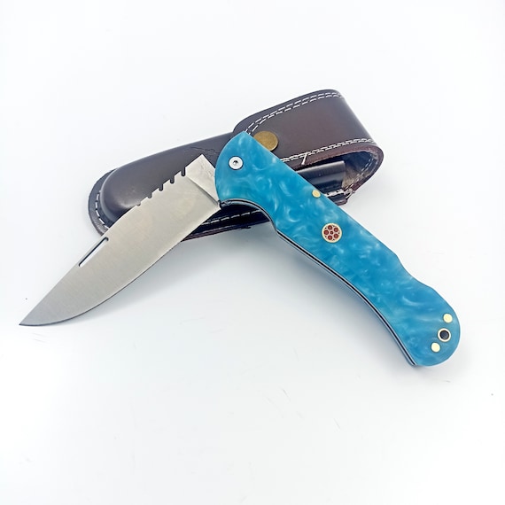 A real folding pocket knife with a custom engraved message and a handmade leather sheath — the kind of heirloom gift a guy actually keeps.