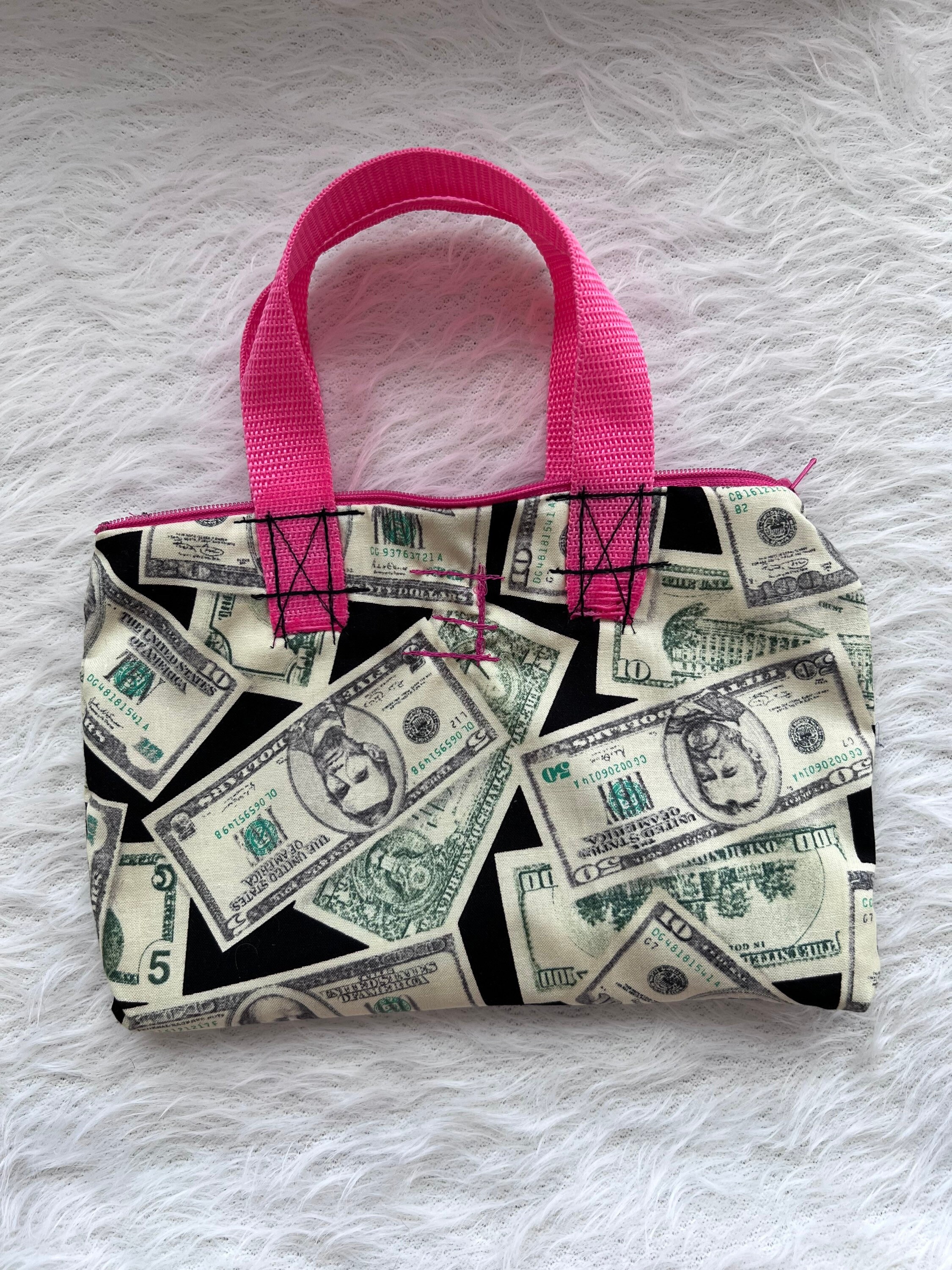 Premium Photo | Closeup of female hands putting a dollar bill in her purse