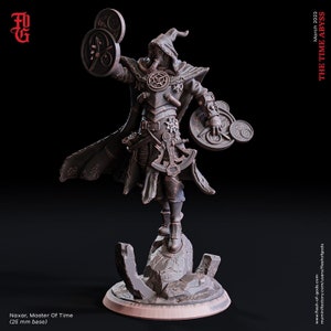 May include: A detailed miniature figure of a time mage wearing a hooded cloak and holding a compass and a clock. The figure is standing on a rocky base.