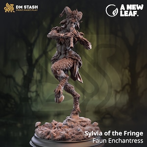 May include: A miniature figurine of a faun playing a flute. The faun is depicted with brown fur, horns, and hooves. The figurine is standing on a base with mushrooms and leaves. The text "Sylvia of the Fringe Faun Enchantress" is printed below the figurine.