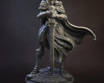 May include: A silver-colored statue of a knight in armor, holding a sword and wearing a crown. The knight is standing on a stone base.