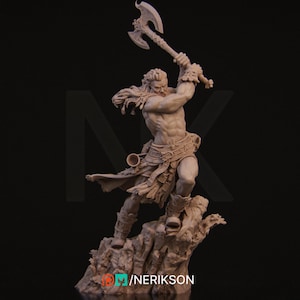 May include: A detailed clay sculpture of a warrior figure with a long beard and a raised axe. The figure is wearing a kilt and is standing on a rocky base. The sculpture is unpainted and has a rough, textured surface.