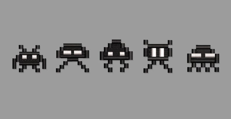 May include: Pixelated black alien creatures with white eyes and various leg designs are displayed against a gray background. The retro-style illustration features five distinct alien designs, reminiscent of classic arcade games.
