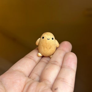 Miniature Pet Potato 1 inch tall.