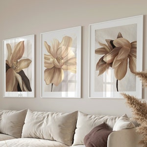 Set of 3 neutral floral wall art prints featuring large close up flowers in neutral tones on off white backgrounds, full colour borderless prints