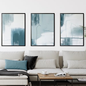 set of 3 duck egg blue colour abstract wall art prints with blue brushstrokes and line art details