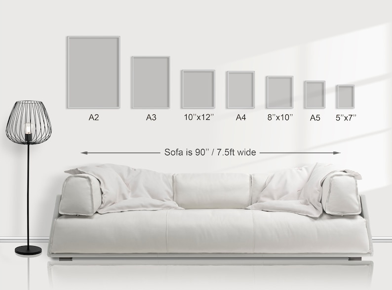 May include: A white sofa is 90 inches wide, with six different sized frames hanging on the wall above it. The frames are labeled with their sizes: A2, A3, 10"x12", A4, 8"x10", and A5 5"x7".