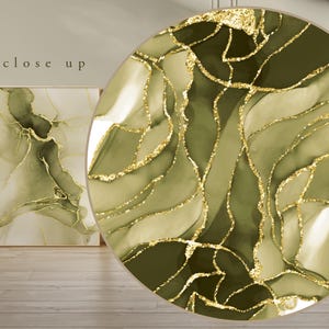 May include: Abstract art print with a green and gold marble design. The print features swirling patterns and gold glitter accents.
