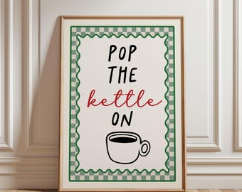 May include: A framed wall art print featuring a cream background with a green and white checkered border. The text reads POP THE in black, kettle in red cursive, and ON in black, followed by a simple black line drawing of a coffee cup.
