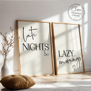 May include: Two framed prints with wooden frames. The left print says "Late Nights &" and the right print says "Lazy mornings" with a heart symbol. The prints are on a cream background. The text "Choose your own colour" is in a circle.