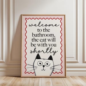 bathroom print with quote, "welcome to the bathroom, the cat will be with you shortly" and funny cat illustration