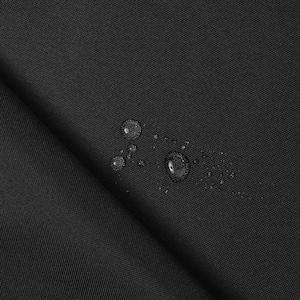 May include: Close-up of black fabric with water droplets. The fabric is folded, showing texture and depth. The water beads on the surface, indicating a water-resistant material. The image highlights the fabric's properties.